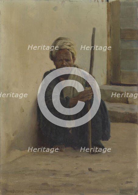 Luxor, Arab holding a stick sitting in a street, 1892. Creator: Henry Brokman.