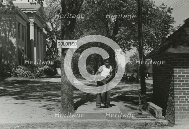 Drinking fountain on the county courthouse lawn, Halifax, North Carolina, 1938-04. Creators: Farm Security Administration, John Vachon.