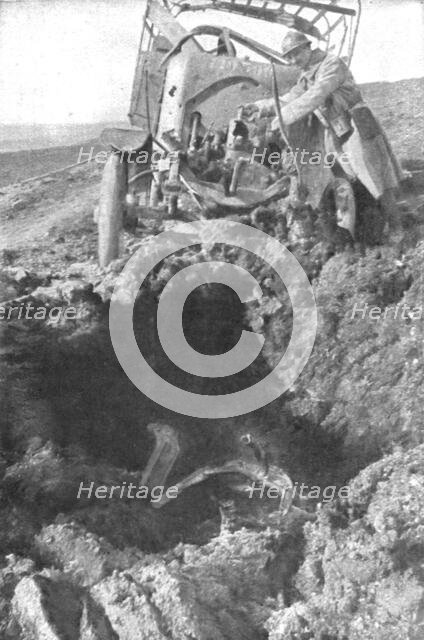 'Au Volant; Camion demoli, pres de Verdun, par un obus de 210: le radiateur detache est..., 1916. Creator: Unknown.