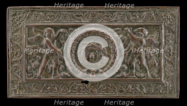 Cover of a writing casket: Geniuses with Wreath and Medusa Head, c. 1500. Creator: Unknown.