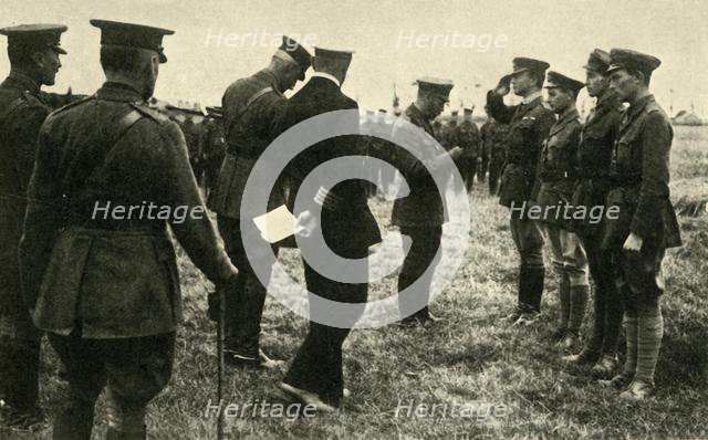 King George V decorates British personnel, Belgium, First World War, 1914-1918, (c1920). Creator: Unknown.