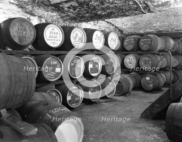 Whisky in barrels at a bonded warehouse, Sheffield, South Yorkshire, 1960.  Artist: Michael Walters