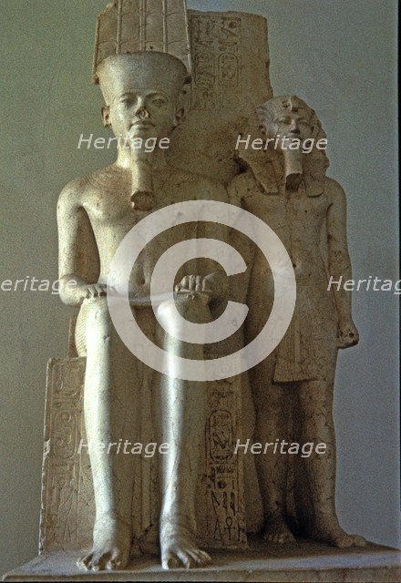 Amon seated beside Tutankhamun, statue made in calcite. Front View, 1350 b.C..