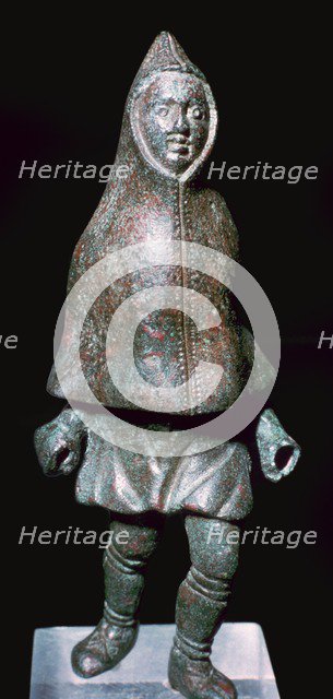 Roman bronze figure of a man wearing a cloak, 4th century. Artist: Unknown