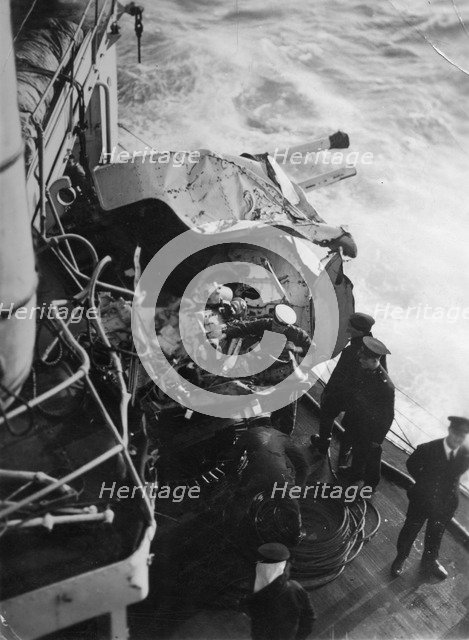 Damaged anti-aircraft gun on the British battleship HMS 'Malaya', off the coast of Portugal, 1937. Artist: Unknown