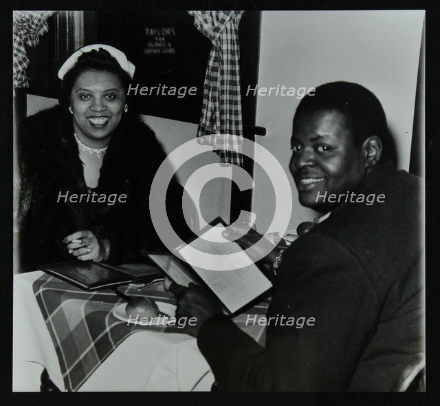 Oscar Peterson looking forward to dinner after a concert at Colston Hall, Bristol, 1955. Artist: Denis Williams