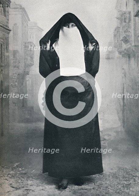 A Turkish lady in outdoor costume, 1912. Artist: Lekegian & Co.