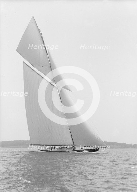 The towering 10,450 sq ft sail area of 'Shamrock IV', 1914. Creator: Kirk & Sons of Cowes.