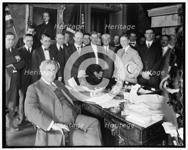 Lindley M. Garrison in office with group, between 1910 and 1920. Creator: Harris & Ewing.