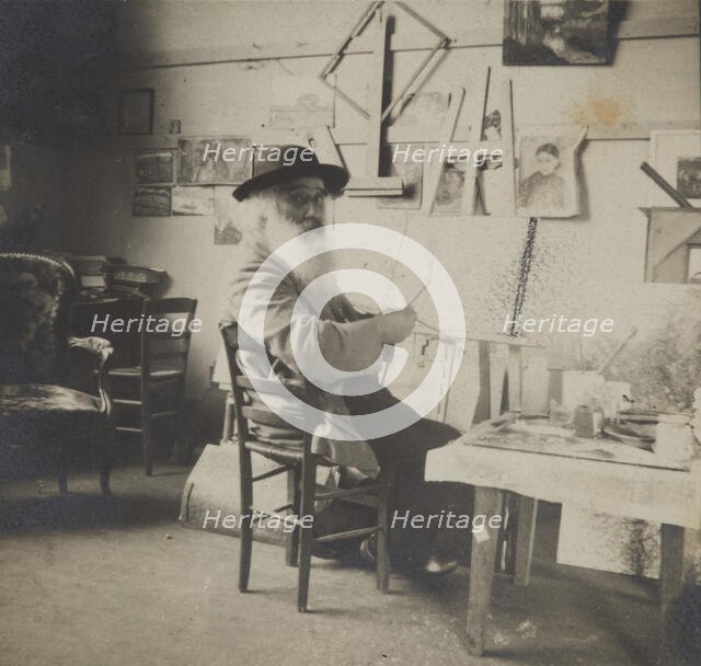 Camille Pissarro painting in his studio, c1860-1903. Creator: Unknown.