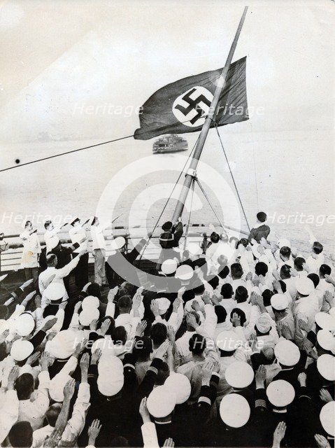 A salute to the Nazi party flag on the SS Bremen, New York, c1935. Artist: Unknown