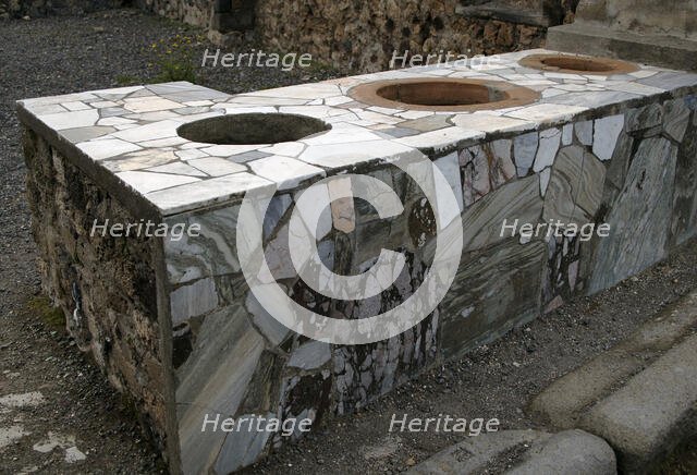 Marble-covered counter, Thermopolium, Pompeii, Italy, 2009.  Creator: LTL.
