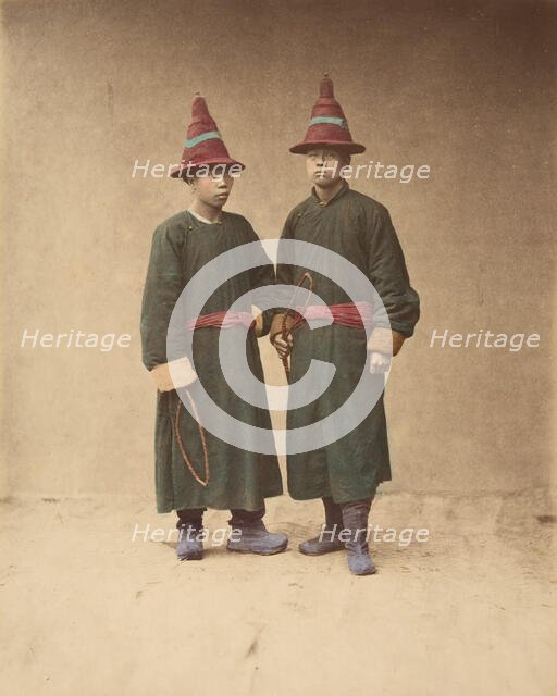 [Two Chinese Men in Matching Traditional Dress], 1870s. Creator: Baron Raimund von Stillfried.
