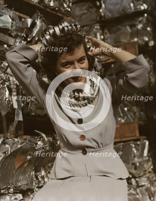 Annette del Sur publicizing salvage campaign...Douglas Aircraft Company, Long Beach, Calif., 1942. Creator: Alfred T Palmer.