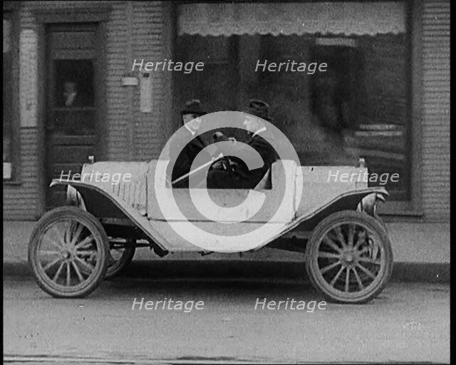 Male Civilians Test Driving the Two Way Car Which Has Two Steering Wheels and Can Be Driven..., 1929 Creator: British Pathe Ltd.