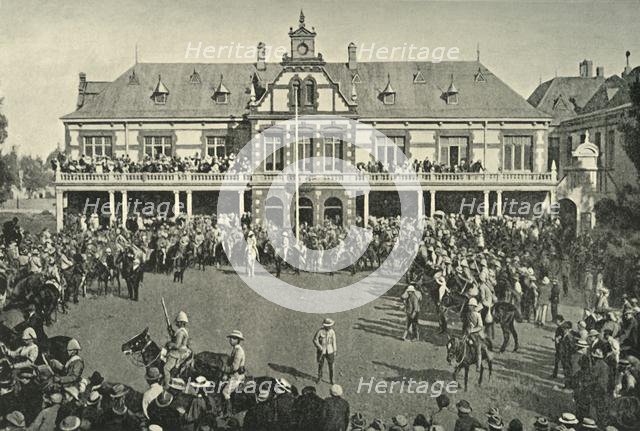 'Hauling Down the Transvaal Flag at Johannesburg', 1901. Creator: Lionel James.