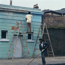 Man re-painting the exterior of a business premises in Kentish Town, London. 1960s. Artist: John Gay.