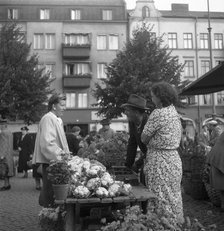 Fruit and vegetable stall selling cauliflowers in the market, Malmö, Sweden, 1947. Artist: Otto Ohm