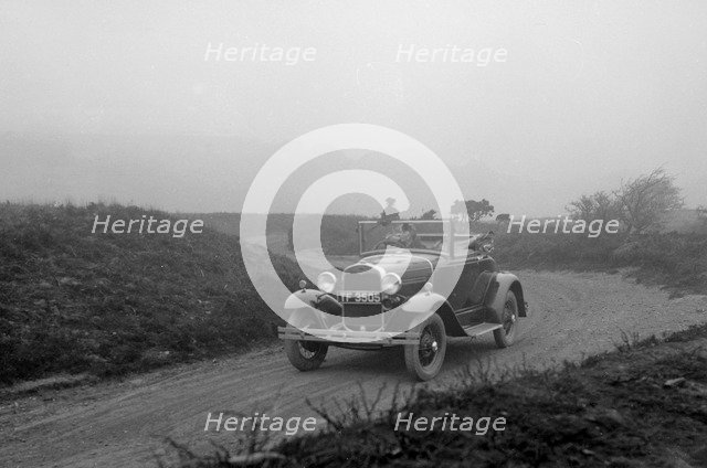 Kitty Brunell driving a 1930 2-seater Ford Model A, 1931.   Artist: Bill Brunell.