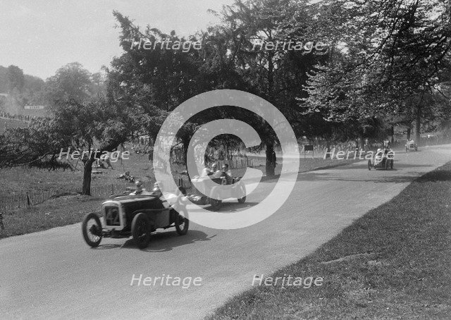 Austin Ulster leading a MG Magnette at Donington Park, Leicestershire, 1930s. Artist: Bill Brunell.