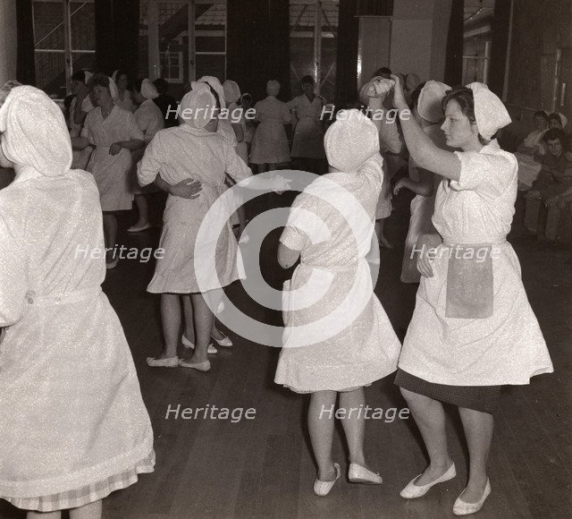 Women employees at Rowntrees Rock and Roll in their work clothes, York, Yorkshire, 1961. Artist: Unknown