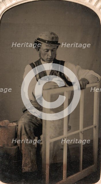 Young Man Painting Window Frame, 1860s-80s. Creator: Unknown.