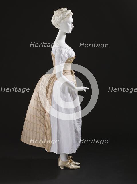 Woman's bustle, England, c.1885. Corset: c.1865-75, Chemise: c.1850-70, Shoes: 1875-1900. Creator: Unknown.