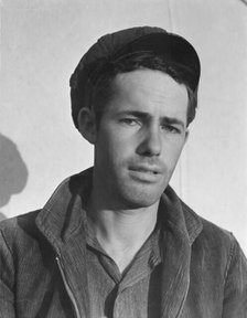 Son-in law of migratory family in FSA labor camp, Calipatria, Imperial Valley, California, 1939. Creator: Dorothea Lange.