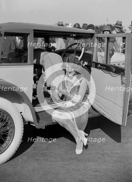 Paddy Naismith pouring a drink from the cocktail bar in her Ballot at the Southport Rally, 1928. Artist: Bill Brunell.