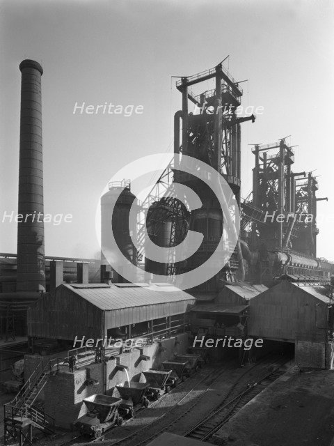 Molten steel being poured into rail trucks at the Stanton Steelworks, Ilkeston, Derbyshire, 1962. Artist: Michael Walters