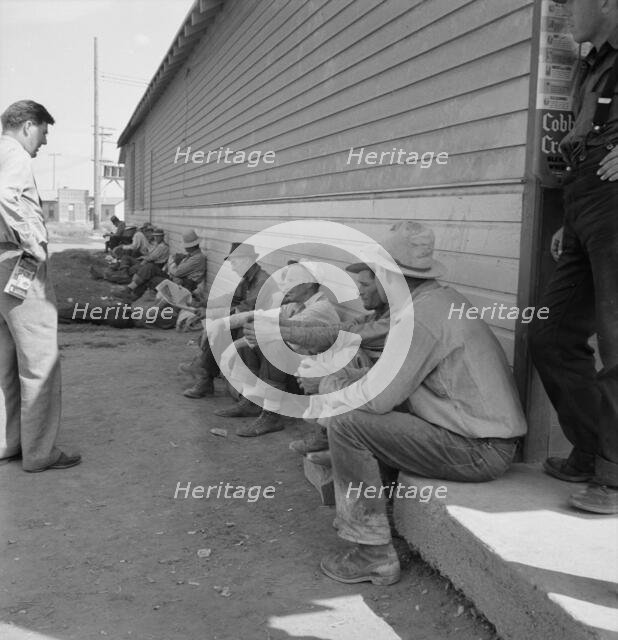 Possibly: Idle men seated in shade on the other side..., Tulelake, Siskiyou County, California, 1939 Creator: Dorothea Lange.