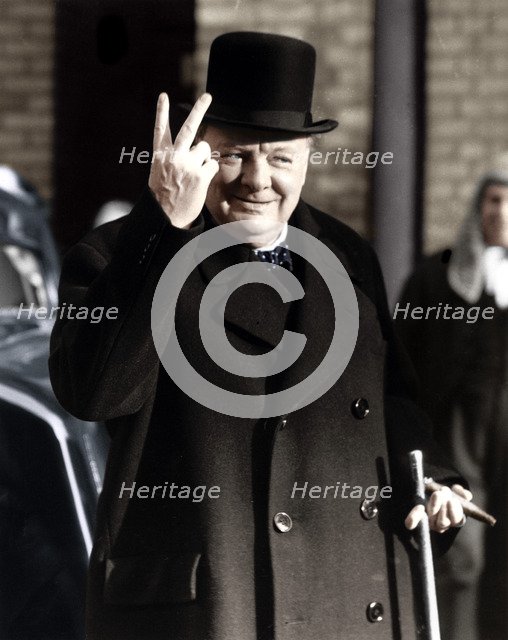 Winston Churchill making his famous V for Victory sign, 1942. Artist: Unknown