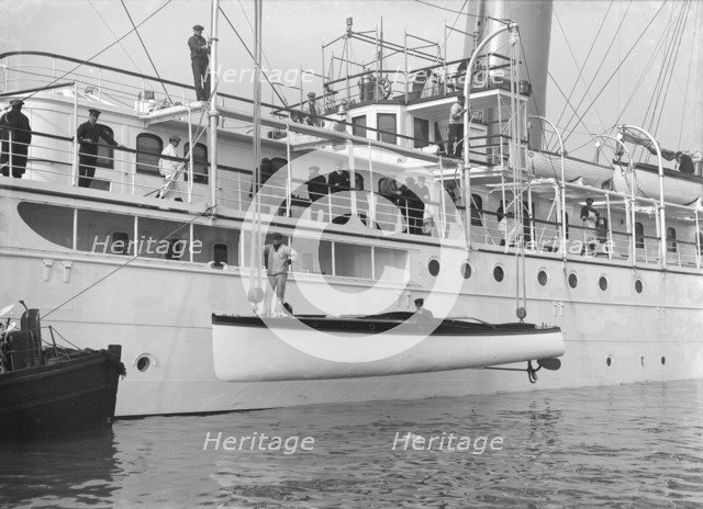 Lowering Liberty's motor launch, 1914. Creator: Kirk & Sons of Cowes.