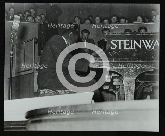 Oscar Peterson in concert at Colston Hall, Bristol, 1955. Artist: Denis Williams