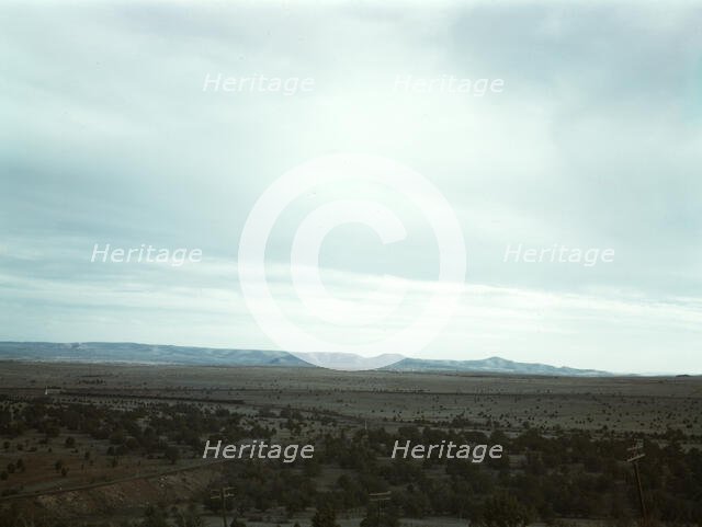 Santa Fe R.R. freight train rounding a curve between Ash Fork and Gleed, Arizona, 1943. Creator: Jack Delano.