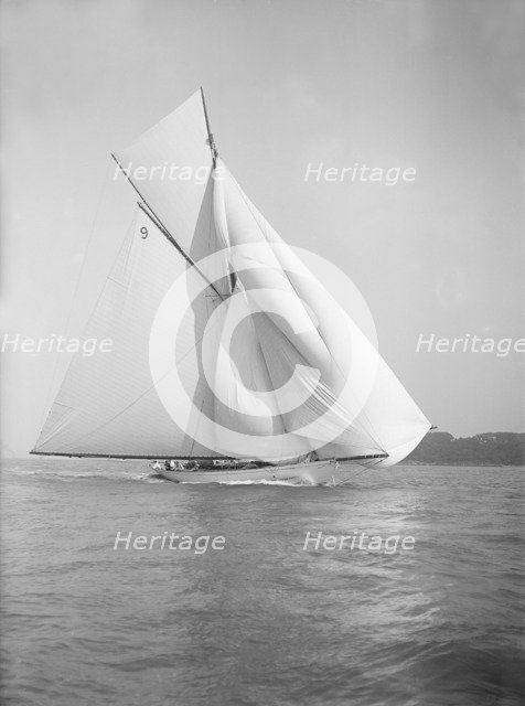 The cutter 'Rosamond' sailing with spinnaker, 1911. Creator: Kirk & Sons of Cowes.