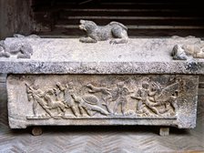 Etruscan stone sarcophagus with reliefs of Eastern influence.