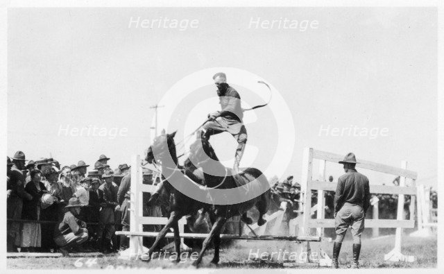 Soldier performing equestrian acrobatics, Fort Sheridan, Illinois, USA, 1940. Artist: Unknown