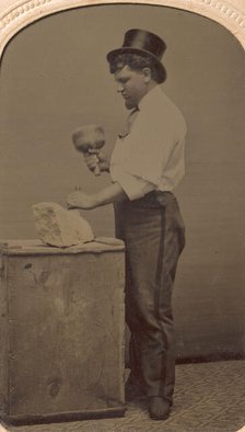 Mason in Top Hat with Mallet, Chisel, and Piece of Stone, 1870s-80s. Creator: J. R. Martin.