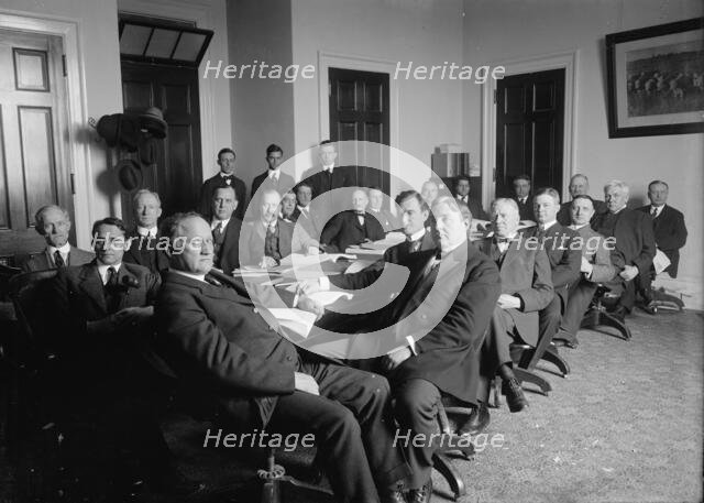House of Representatives Committees - Agriculture. in Front of Table: Reps. Lever..., 1914 or 1916. Creator: Harris & Ewing.