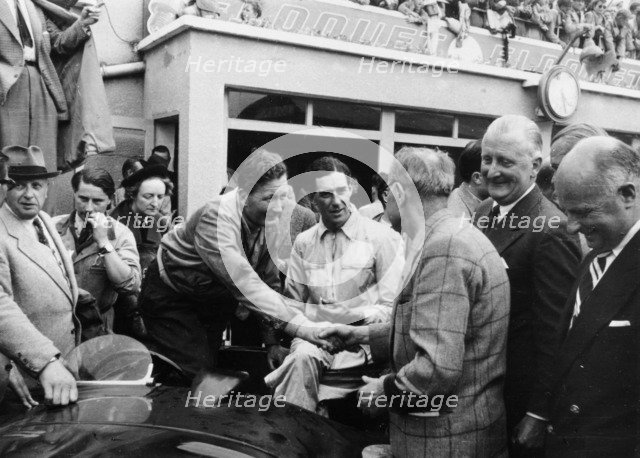 Peter Whitehead being congratulated on his victory with Peter Walker of the Le Mans 24 hours, 1951. Artist: Unknown