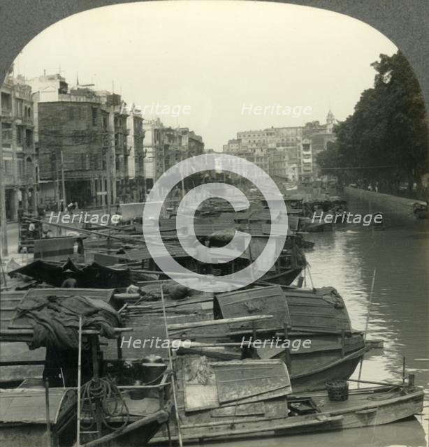 'The Canal between Canton and the Island of Shameen, China', c1930s. Creator: Unknown.