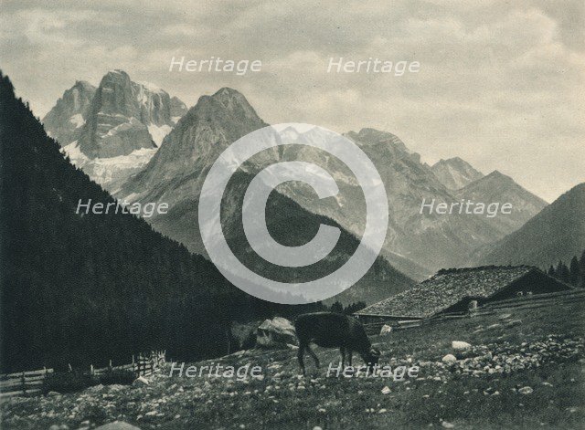 View of the Brenta Group with alpine pasture, Madonna di Campiglio, Dolomites, Italy, 1927. Artist: Eugen Poppel.