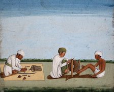 Two men sharpening a knife whilst the third prepares the blade on a sword, (between 1800 and 1899?). Creator: Unknown.