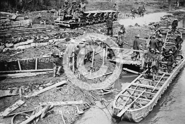 British loading pontoon boats with ammunition, 22 Apr 1917. Creator: Bain News Service.