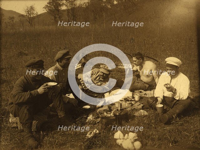 Lunch at the halt. Group portrait, 1920-1929. Creator: Unknown.