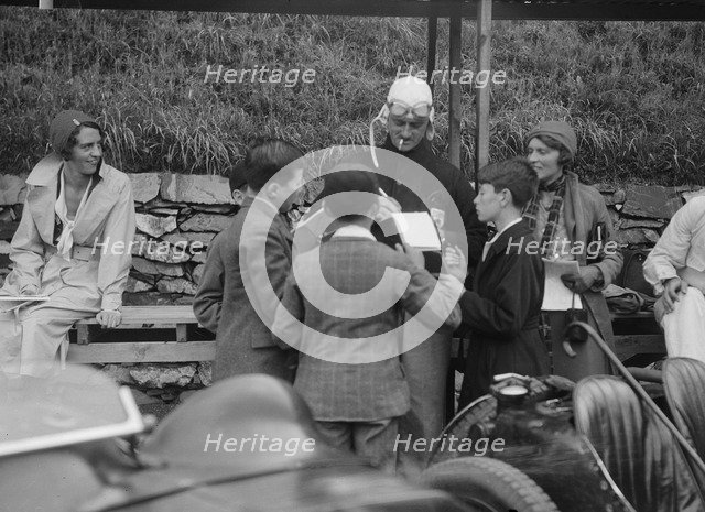 Goldie Gardner signing autographs at the Irish Grand Prix, Phoenix Park, Dublin, 1930. Artist: Bill Brunell.