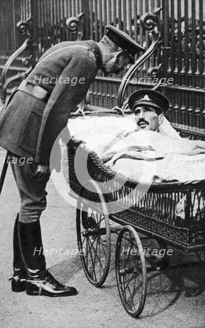 George V with a wounded soldier, 7th Battalion Sherwood Foresters, March 1918. Artist: Unknown