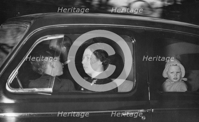 The Royal couple leaving Clarence House for Windsor after George VI's death, 1952.  Creator: Unknown.