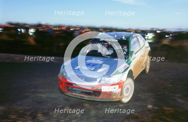 2002 Hyundai Accent WRC on 2002 Network Q rally, Kankkunen. Artist: Unknown.